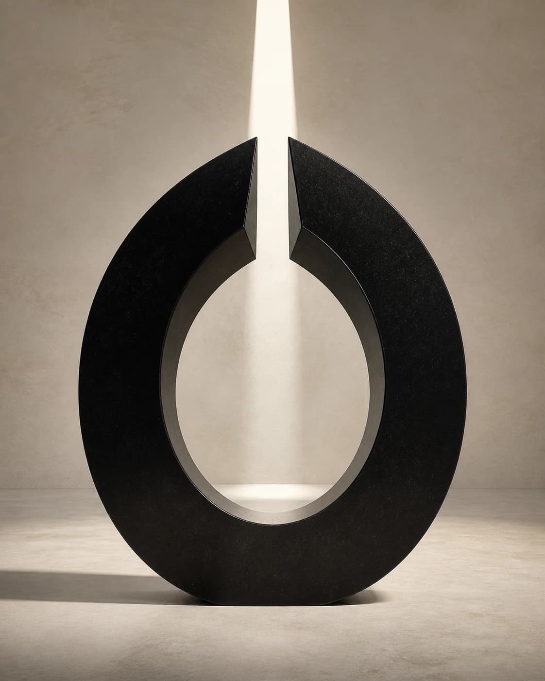 A monumental split obsidian ring in a warm stone chamber